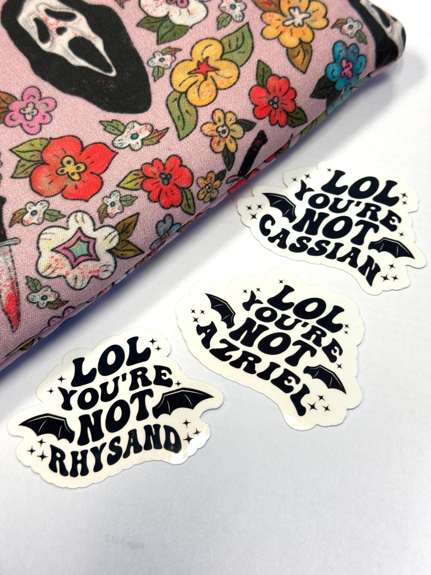 3 stickers of "LOL You're Not Rhysand, Cassian, or Azriel" with bat wings